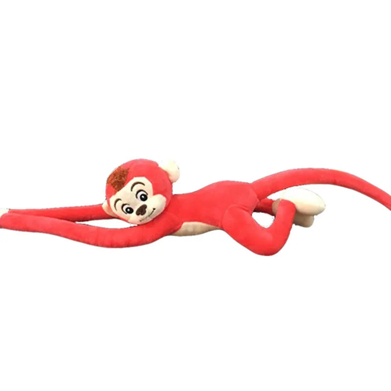 Long arm hanging monkey plush toy decoration in pink colour draped over curtain pole