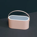 Portable pink makeup mirror storage box with adjustable angle and organiser compartments