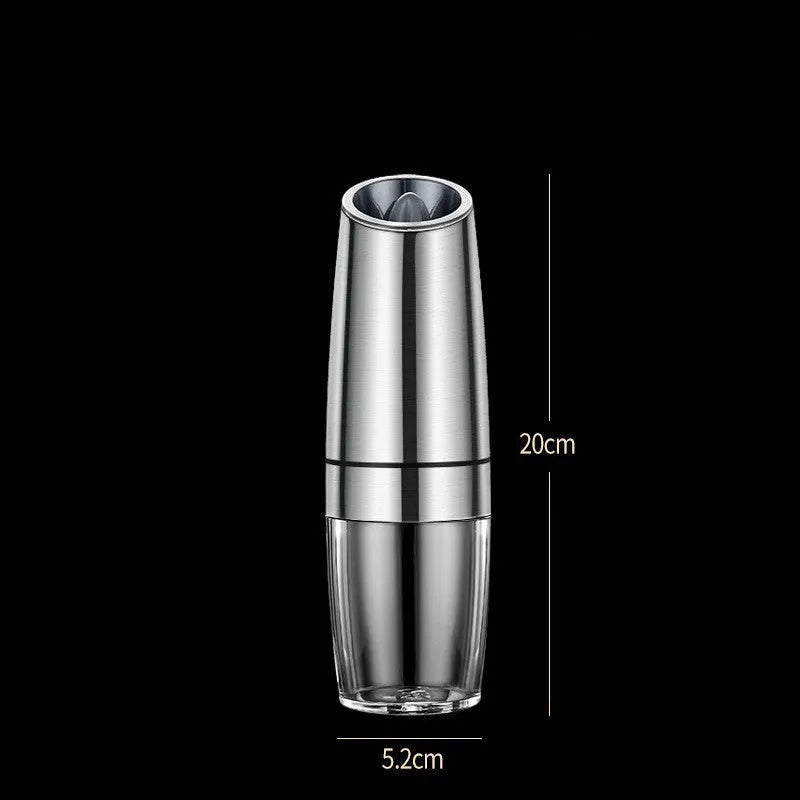 Black and silver rechargeable electric pepper grinder with clear acrylic body on a kitchen counter