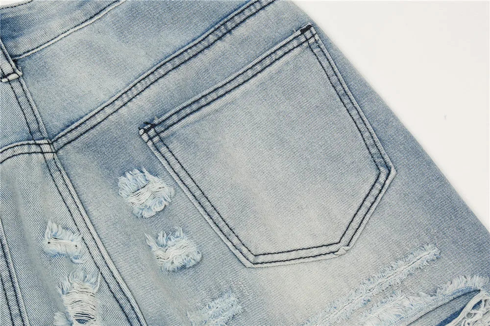 Men's flared washed jeans in light blue denim with zipper fly
