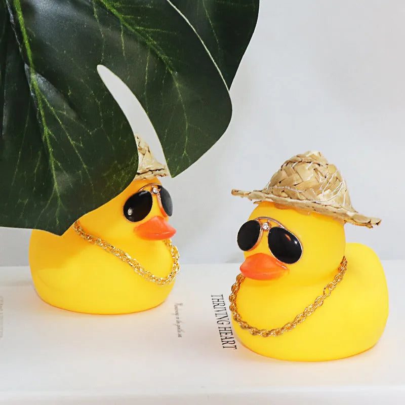 Yellow cartoon duck wearing straw hat car dashboard decoration with adhesive gel and sunglasses accessory