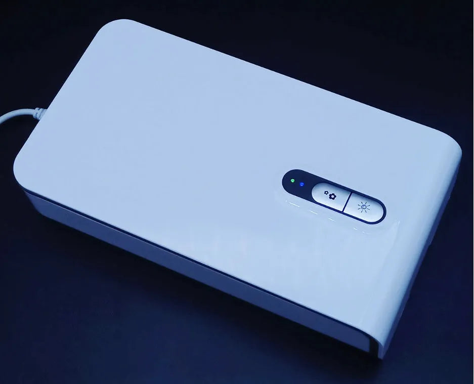 Multifunctional mobile phone steriliser with dual UV lamps and built-in charging port in blue colour