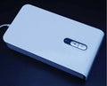 Multifunctional mobile phone steriliser with dual UV lamps and built-in charging port in blue colour