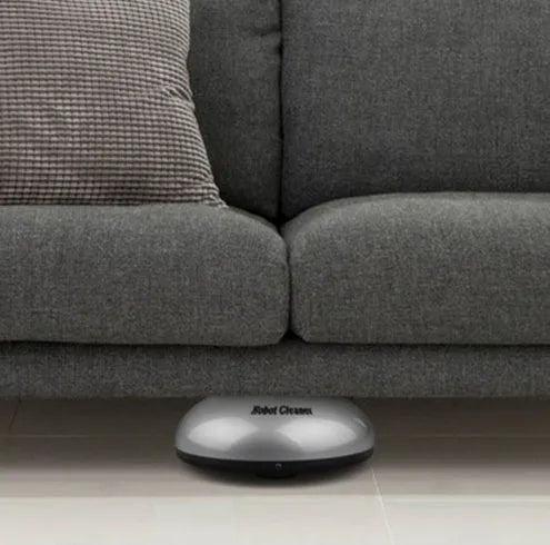 Silver mini robotic vacuum cleaner with compact dimensions for automated floor cleaning