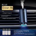 Obsidian black smart car aroma diffuser clipped onto a car air vent