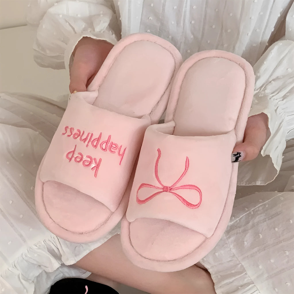 Ladies cotton slippers with suede upper, artificial wool lining, flat non-slip PVC sole, bow and letter detail, beige yellow pink black