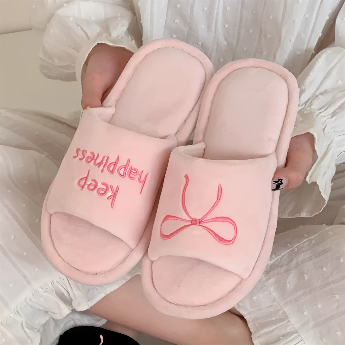Ladies cotton slippers with suede upper, artificial wool lining, flat non-slip PVC sole, bow and letter detail, beige yellow pink black