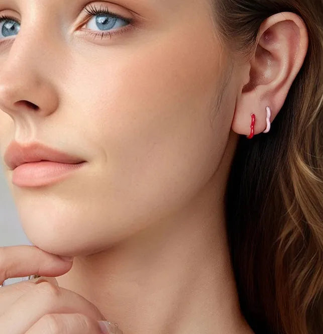 Pair of 925 silver heart stud earrings with pink or red dripping oil finish