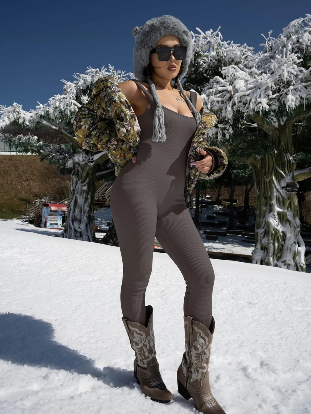 Women's beige long sleeve suspender tights with tank top straps and button details on a mannequin.