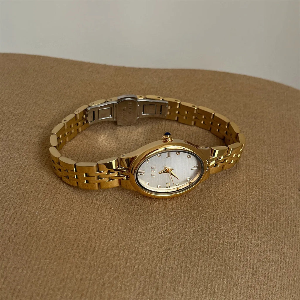 Oval dial watch with 37mm case, 10mm thickness, dot markers, and stainless steel butterfly clasp in gold or silver