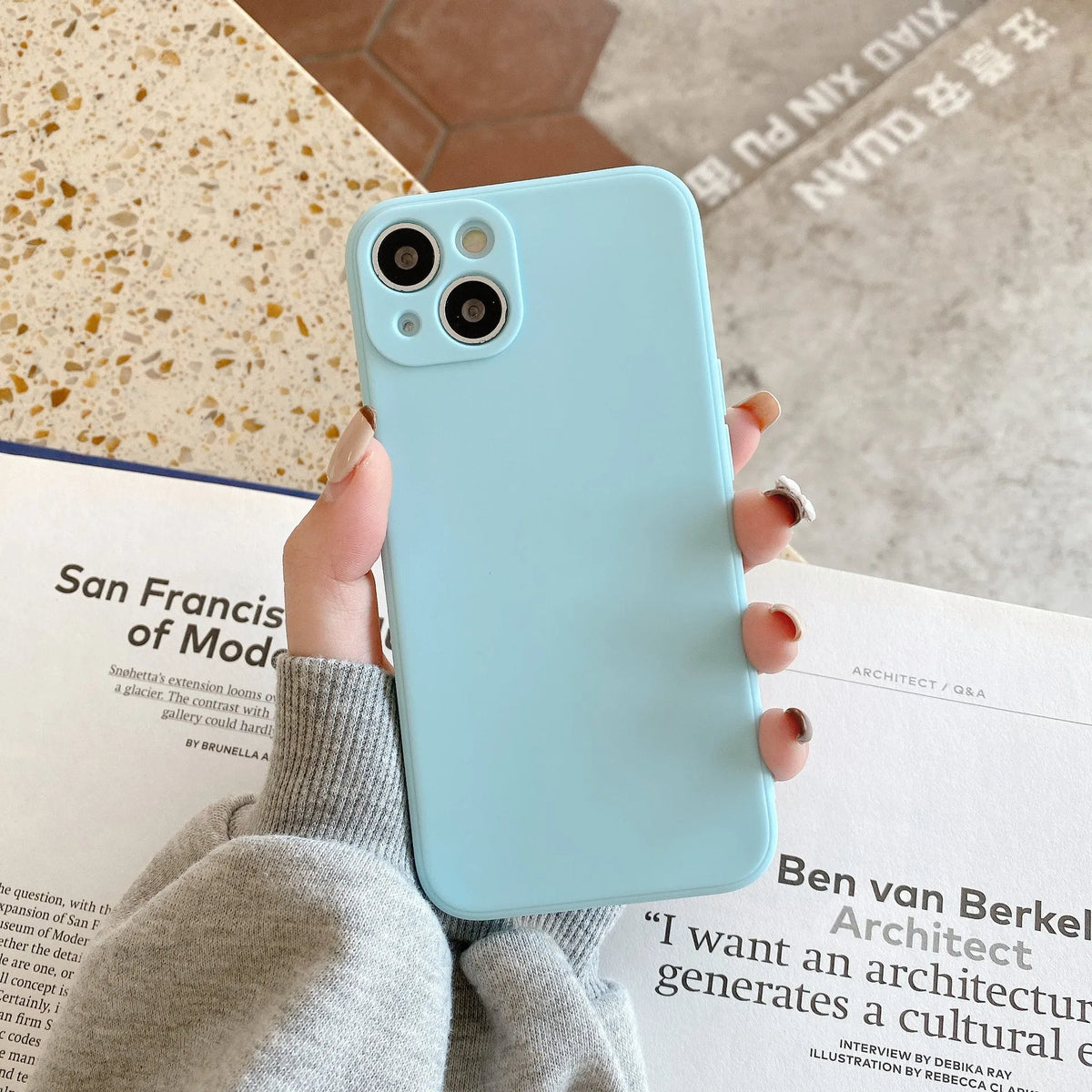 Solid colour TPU iPhone case with straight edges, shown in black, compatible with iPhone 14 and other models.