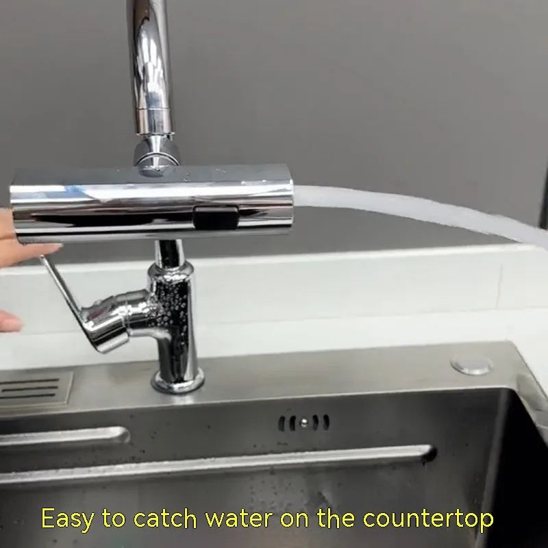 Brushed nickel kitchen faucet connector with pull-down sprayer, showing waterfall water flow mode.