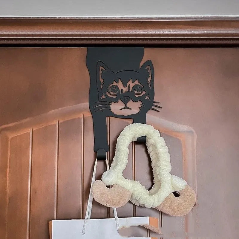 Black iron cat-shaped wall hook with punch-free mounting for decorative hanging