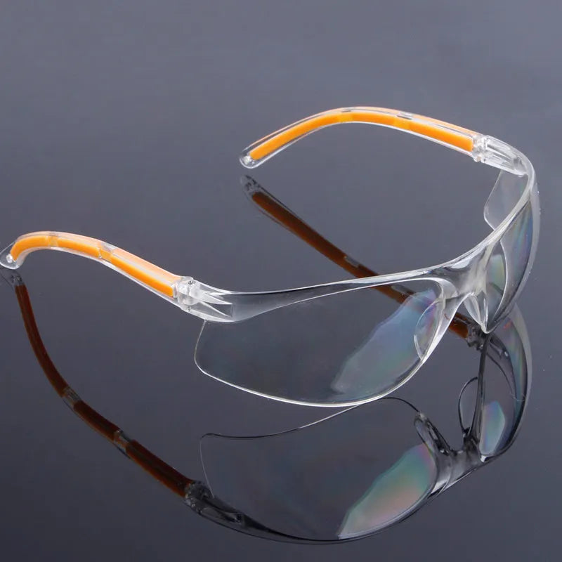 Transparent safety goggles with yellow frame made from impact-resistant polycarbonate