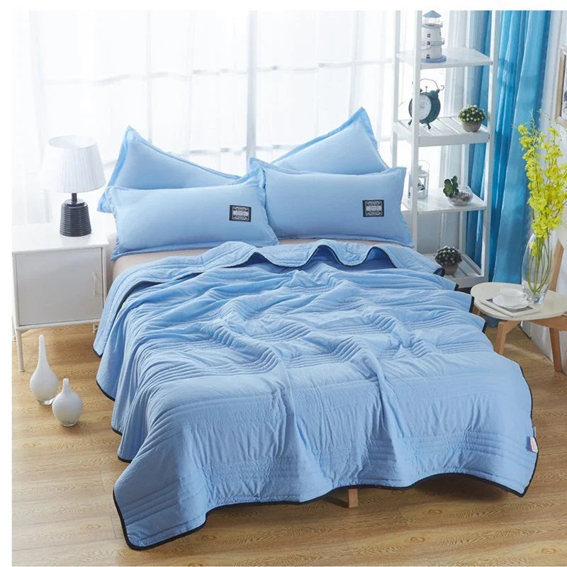 Lightweight, breathable cooling comforter in various colors and sizes for comfortable summer sleep