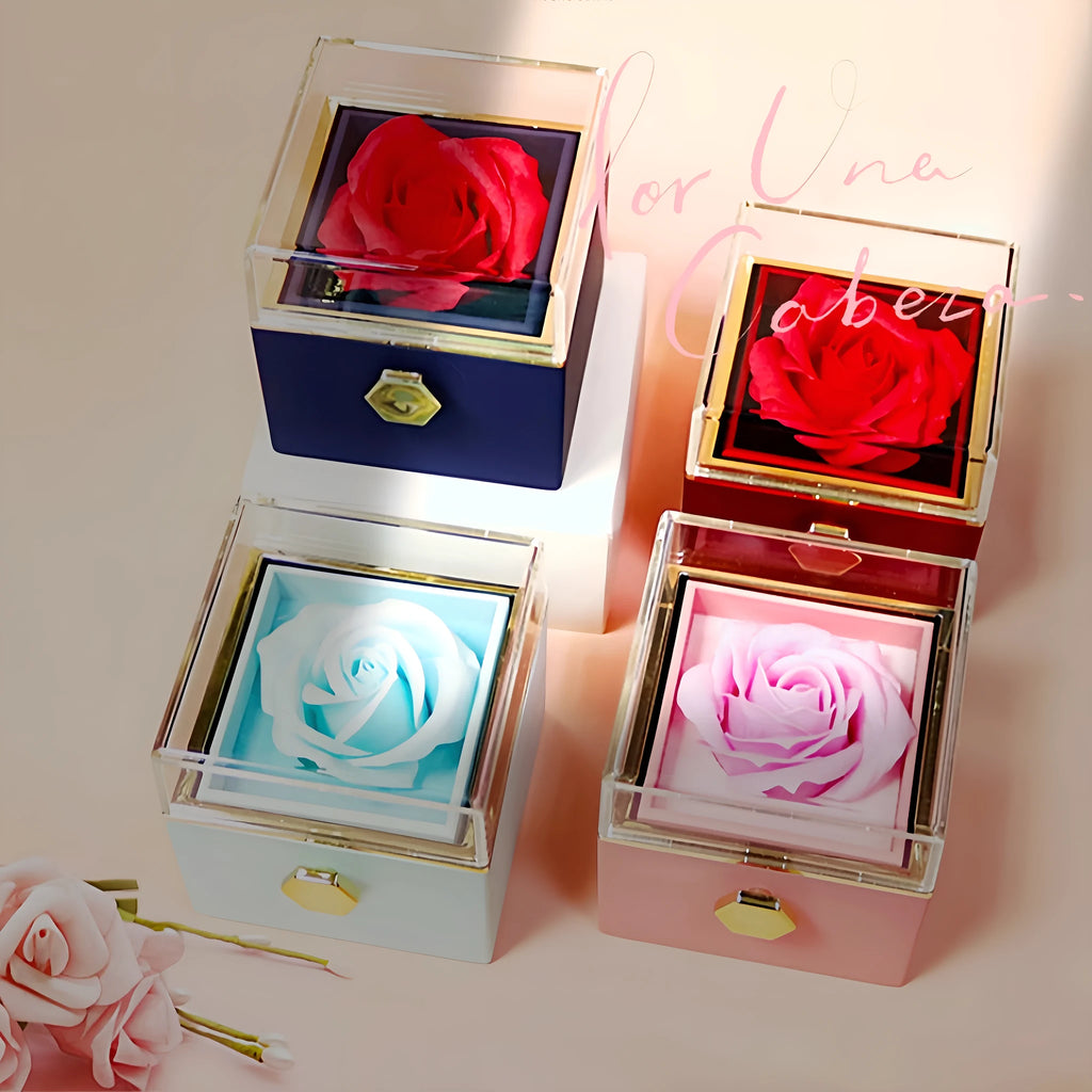 Rotating jewellery box with preserved red rose under acrylic cover and drawer open showing storage