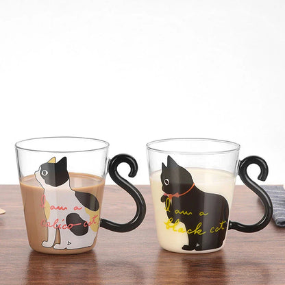 Adorable cat-shaped glass mug with a playful cat tail handle, perfect for coffee, tea, and juice lovers