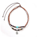 Men's turquoise wooden bead necklace with geometric alloy pendant on cream wax rope