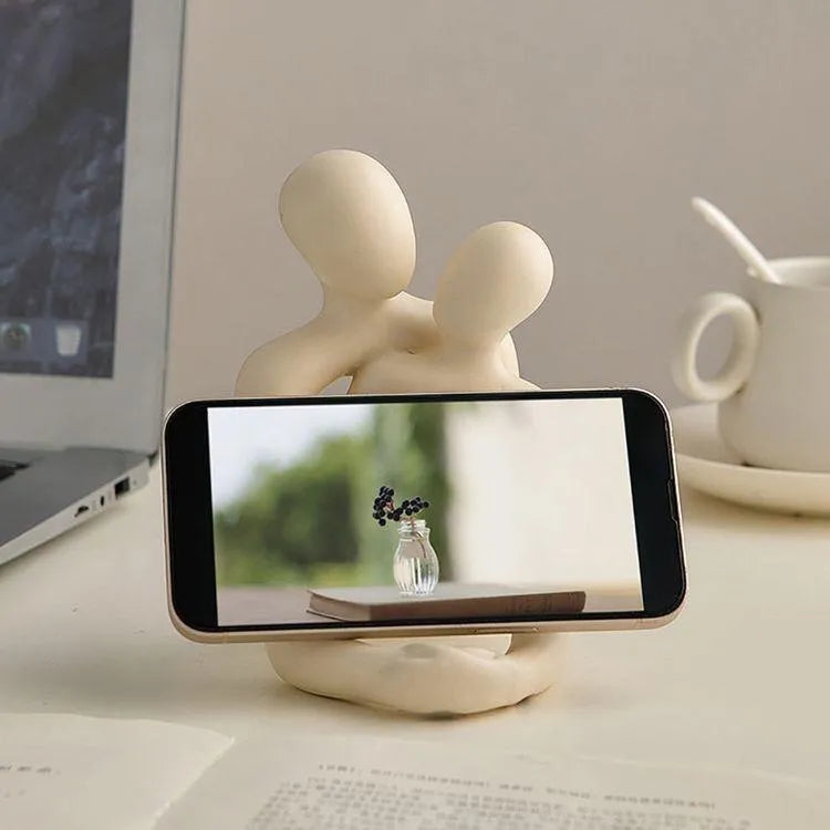 Modern simplicity style resin couple statue in milky white or gold finish.