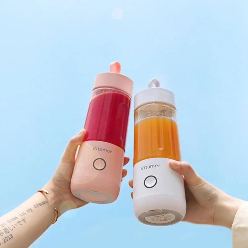 White portable USB blender bottle with silicone handle and stainless steel blade inside.