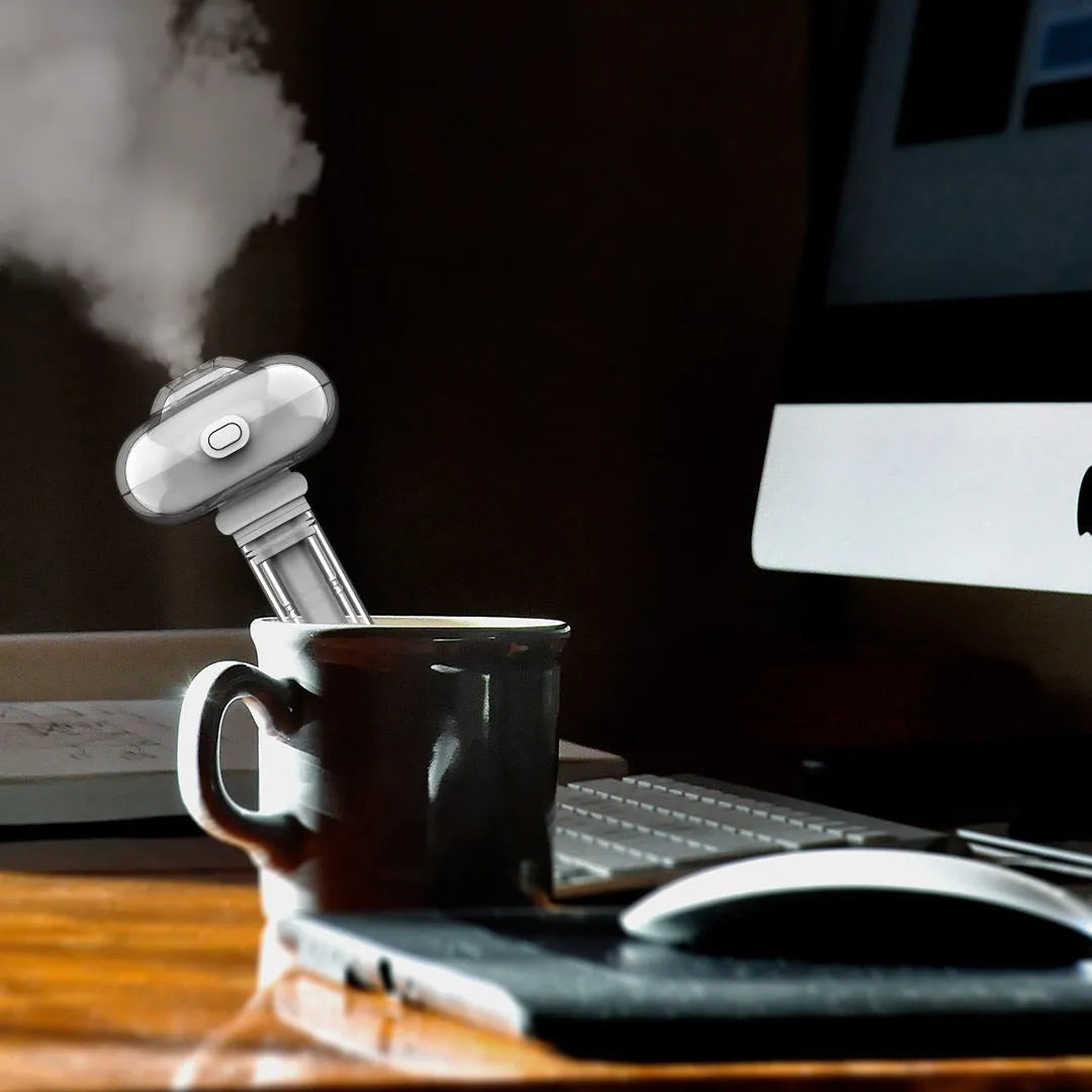 White USB portable desktop humidifier with small night light, adjustable height 163-238mm, on a desk