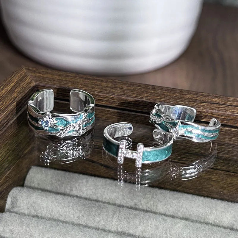 Mint green enamel asterism ring with folded copper construction and dripping oil treatment