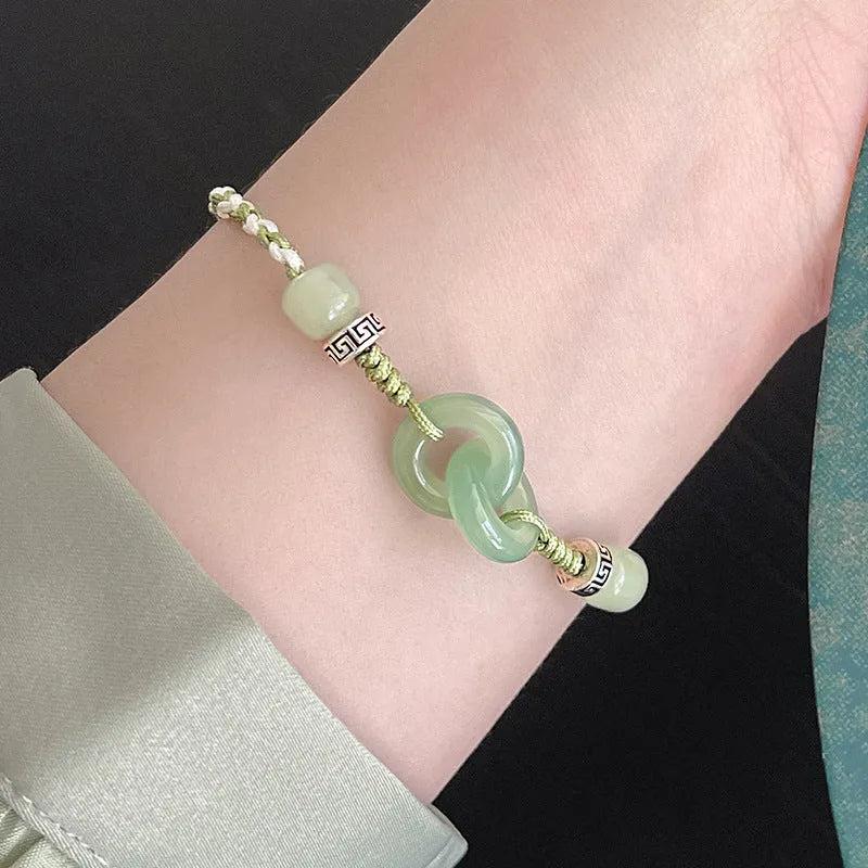 Green copper bracelet with ethnic peace buckle design and jade double ring strap