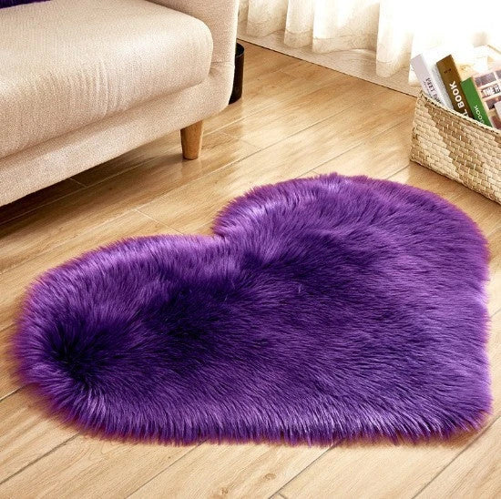 Soft and plush heart-shaped rug in various colors, perfect for cozy home decor