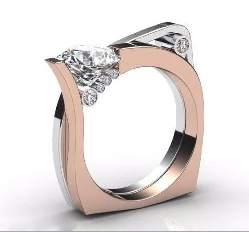 Rose gold electroplated geometric couple rings with zircon stone inlay on display