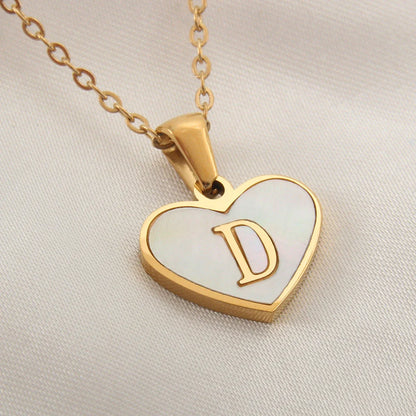 A personalized heart-shaped necklace with a 26-letter charm, crafted from high-quality stainless steel and gold plating.