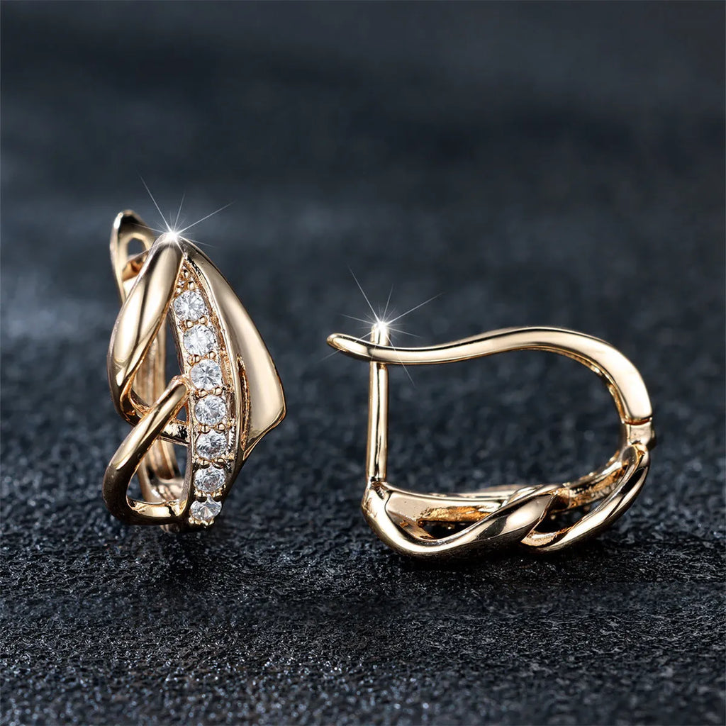 Champagne gold copper ear clip with white diamond centre, geometric arrow shape