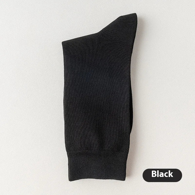 Men's mid-calf length solid colour business socks in combed cotton on a white background.
