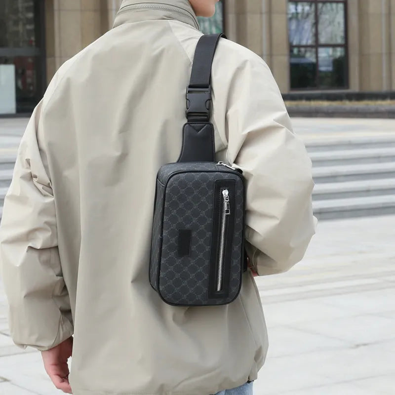 Men's black crossbody shoulder bag with printed chest design and sewing line detailing
