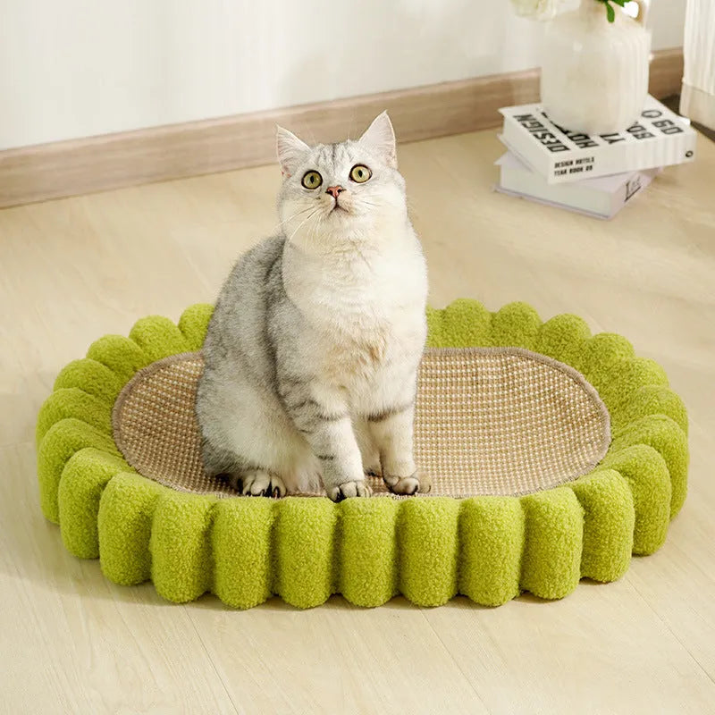 Green oval cat scratcher pad with sisal surface serving as scratching area and cat bed