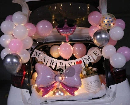 Romantic car trunk proposal decoration kit with balloons, ribbons, and accessories for creating a magical surprise