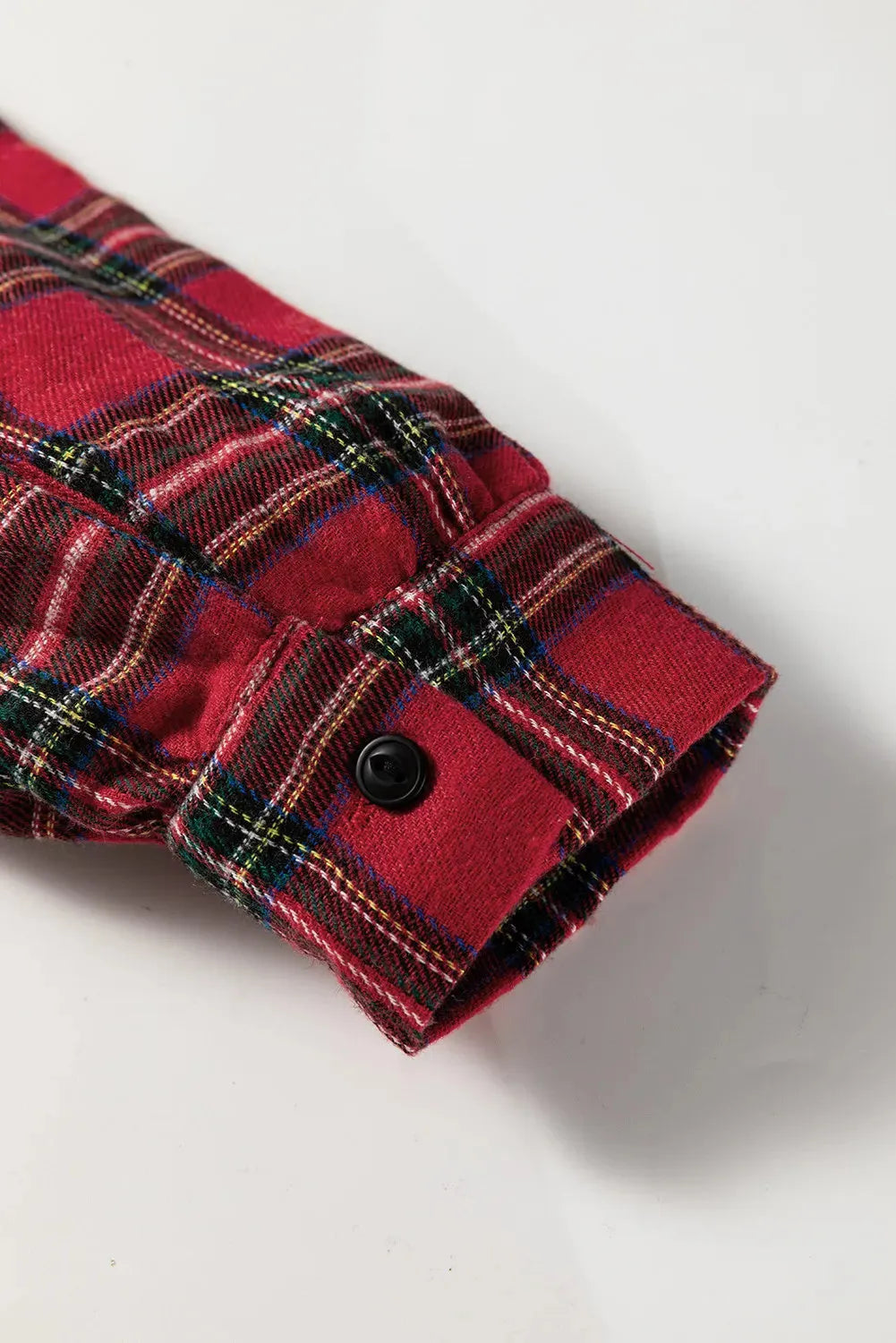 Red plaid women's mini dress with shirt collar, long sleeves, half-button front, and ruffle hem.