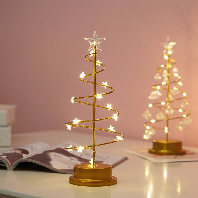 Gold crystal Christmas tree LED light with battery-powered warm glow on a shelf