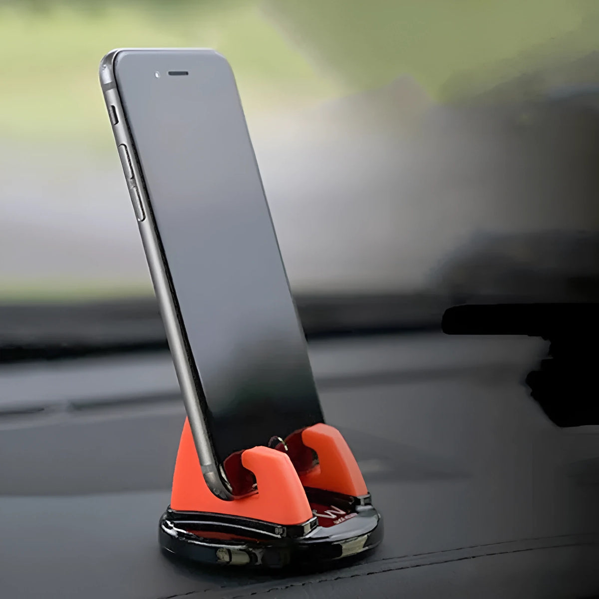 Mini dashboard car phone holder in black with 360-degree rotation, PC and silicone build, universal phone stand.