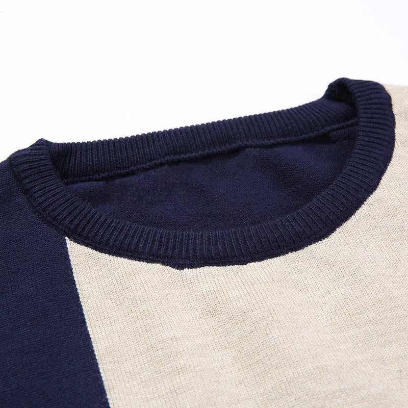Men's wool crew neck pullover sweater in dark blue, shown on a model