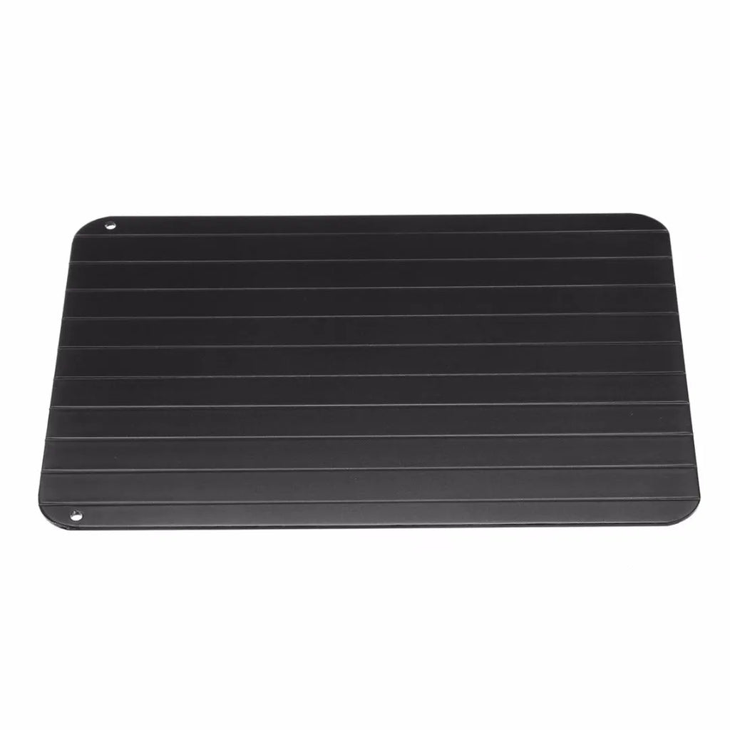 Black aluminium fast defrosting tray for kitchen use on a countertop