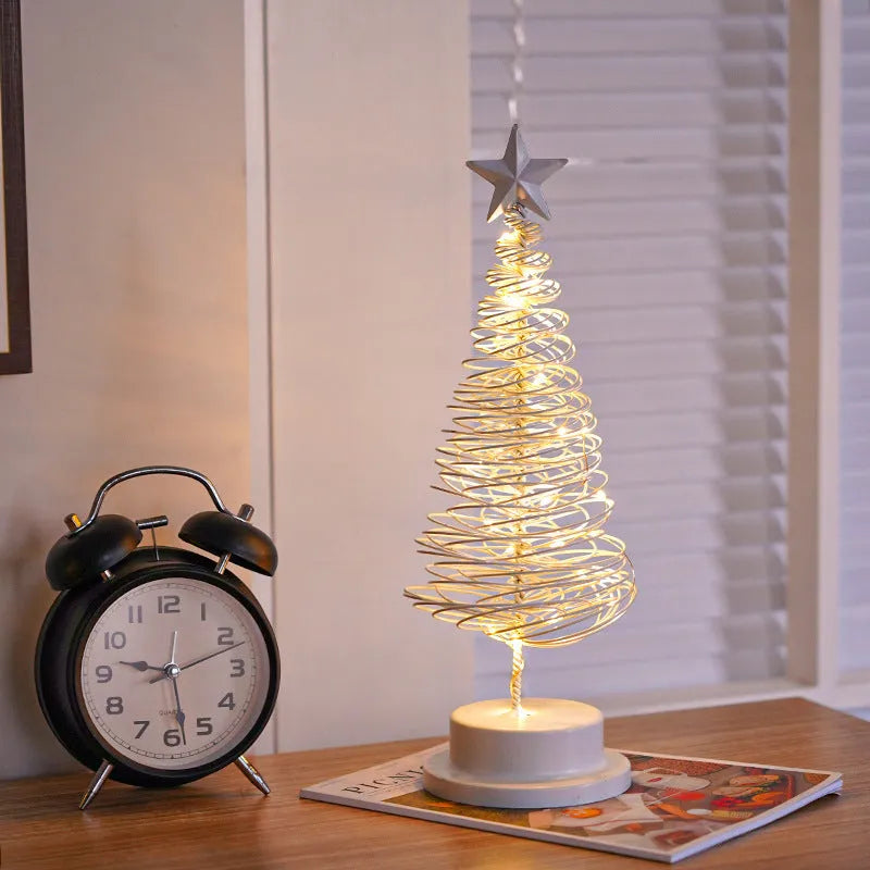 Metal spiral Christmas tree table lamp with warm white LED lights, 33cm tall.