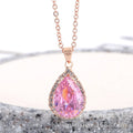 Women's pink alloy water drop necklace with geometric design and rose gold rhinestones on model