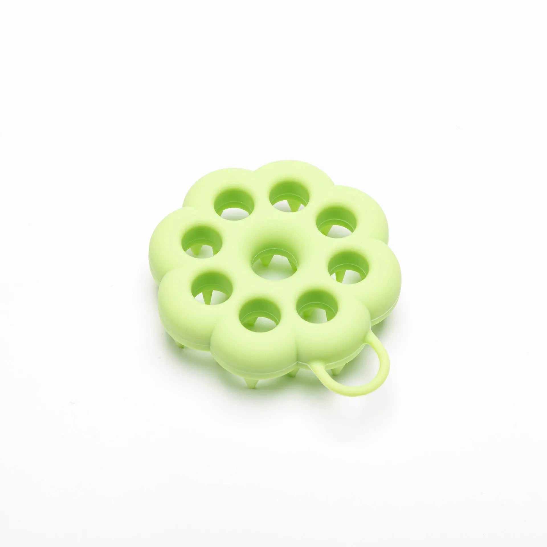 Silicone pet grooming brush in multiple colours for dogs and cats, showing flexible bristles.
