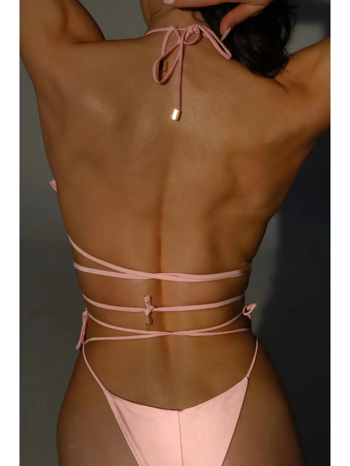 Pink halter lace-up bikini set with three-dimensional floral detail, split swimsuit with briefs bottom