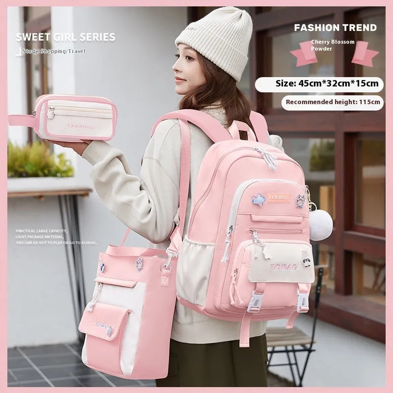 Waterproof pink school backpack for girls with curved straps and a matching pencil case.