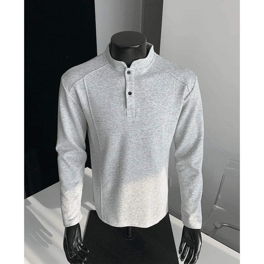 Men's grey polo shirt with patchwork detailing on shoulders and stand-up collar