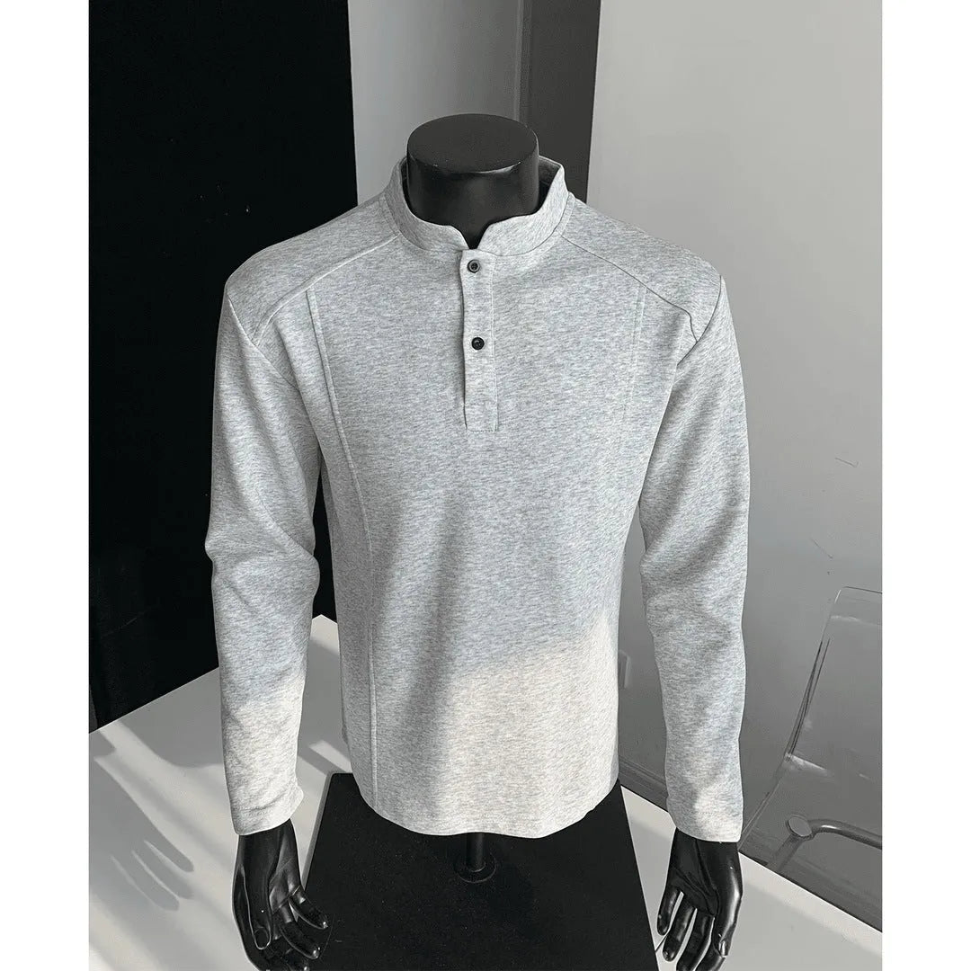 Men's grey polo shirt with patchwork detailing on shoulders and stand-up collar
