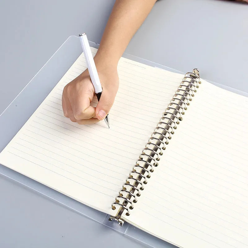 A5 loose-leaf notebook with 26-hole binder system showing horizontal line ruling on paper