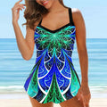 Colourful printed plus size swimsuit for women with loose belly-covering fit, on a hanger.