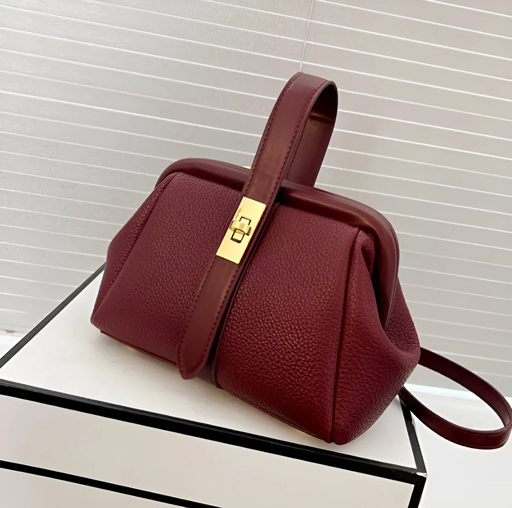PU leather shoulder bag in cross-square shape with visible sewing line detail, available in four colours